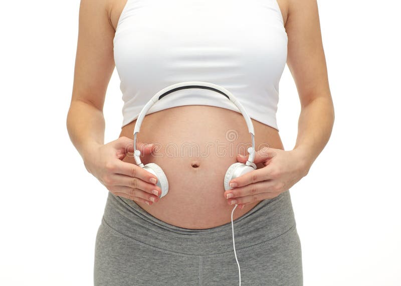Belly pregnant woman with headphones Stock Photo by ©svyatoslavlipik  34774629