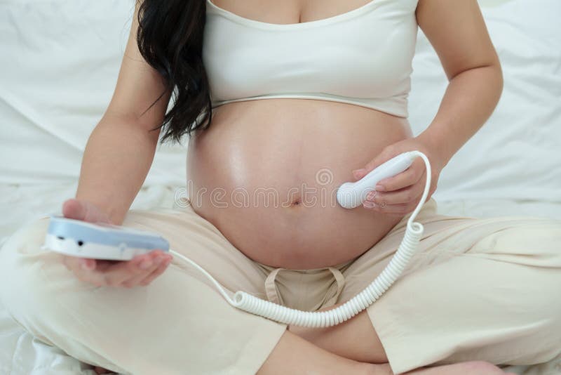 Close Up of Pregnant Woman and Headphones on Tummy Stock Image - Image of  motherhood, belly: 51324951