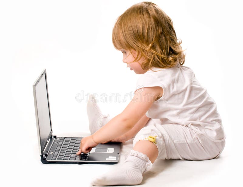 Close-up of pretty baby working at laptop