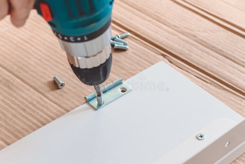 Closeup of the Process of Installation a Furniture with Electric