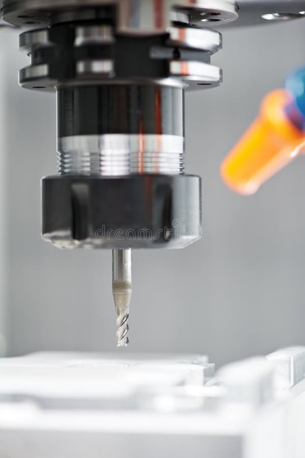 Close-up process of metal machining by mill royalty free stock image