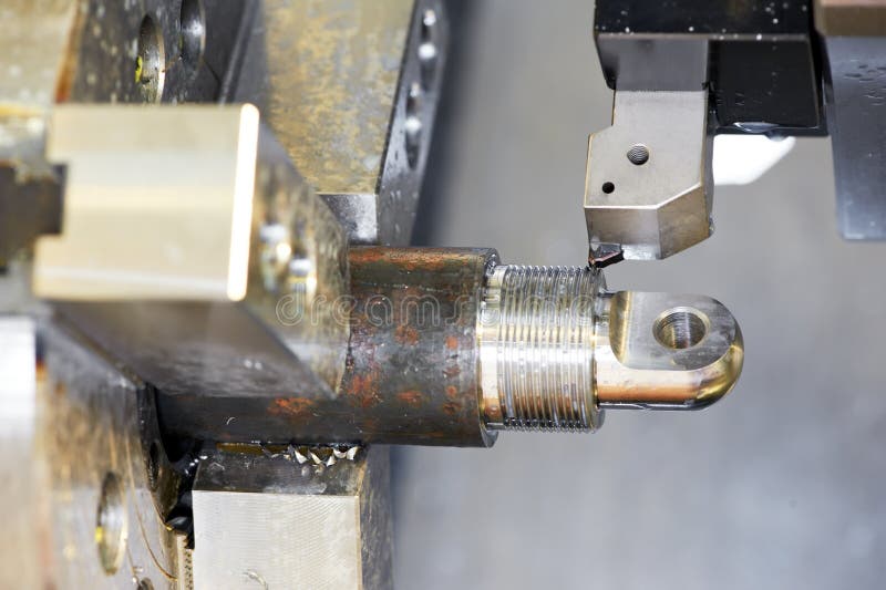 Close-up process of metal machining by threading stock photo