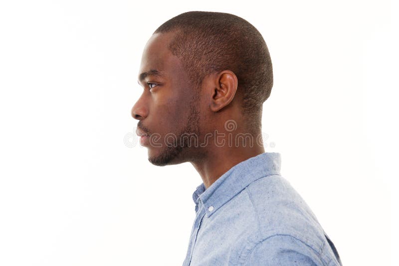 Close up profile of handsome young black man against isolated white background