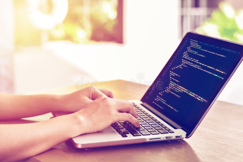 Close-up of Programmer`s Hands Working on Source Codes Over a Laptop ...