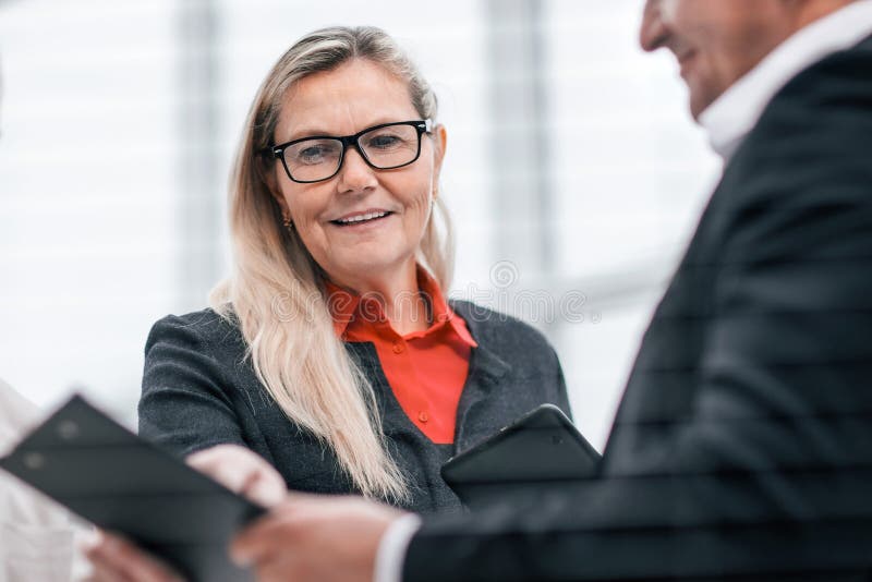 Close up. project Manager discussing with employees working documents. royalty free stock image Close up. project Manager discussing with employees working documents. royalty free stock image