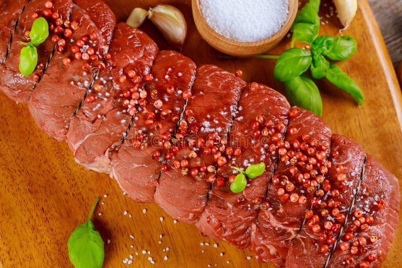 Close Up Raw Piece of Beef Steak with Spices and Salt Stock Image