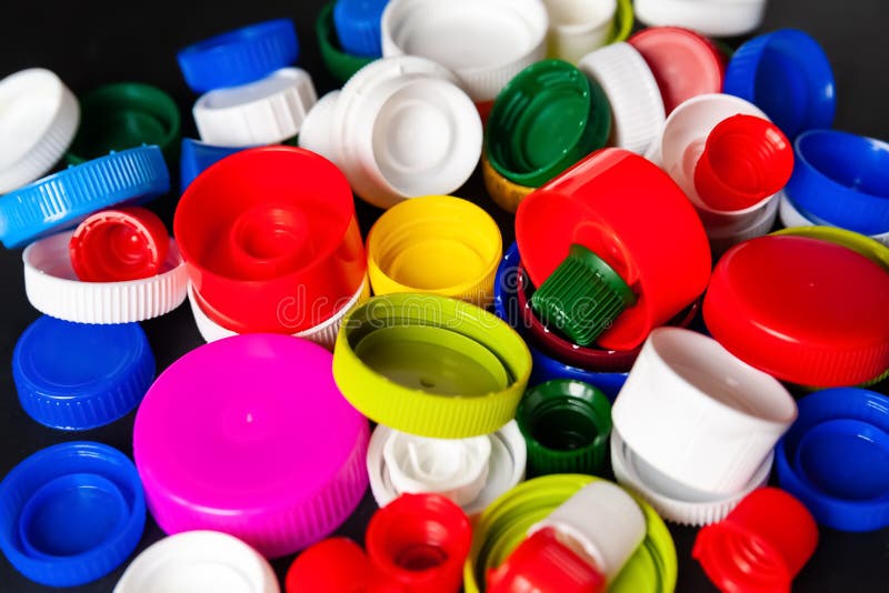Closeup of Recycled Plastic Bottle Caps. Colored PET Lids. Separate