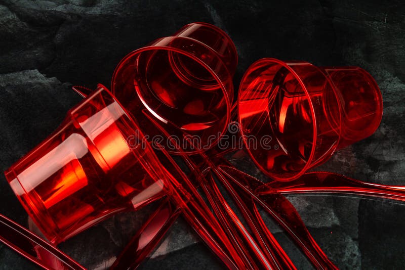 Close up red disposable empty plastic utensils. stock images