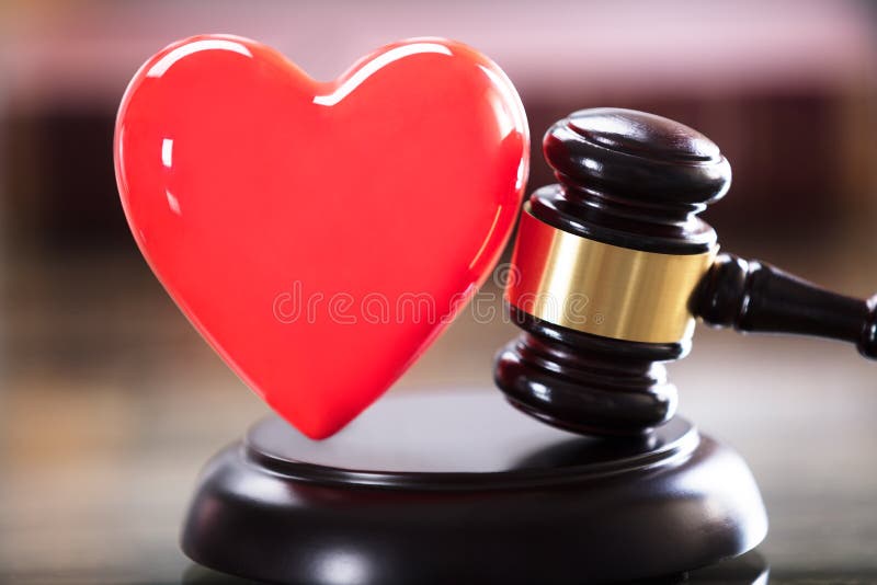 Close-up Of Red Heart And Gavel