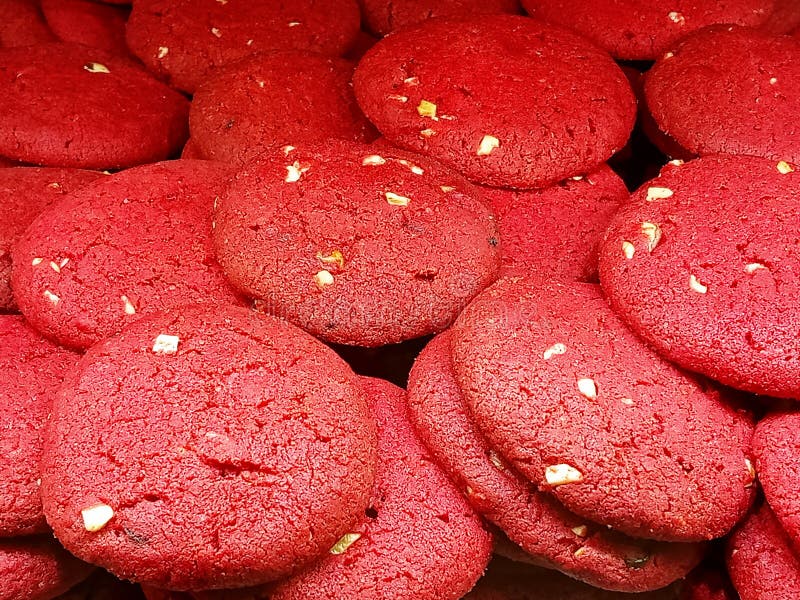 Close up of red velvet cookies with almonds arranged randomly