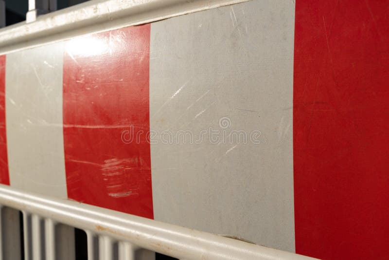 Close Up of a Red and White Plastic Barrier at a Construction Site