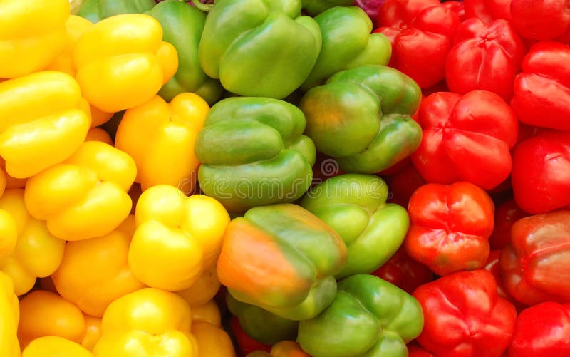 Close up of red, yellow and green peppers