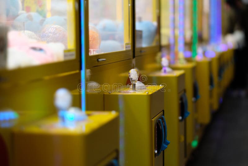 Close up a row of claw crane machine. blur background