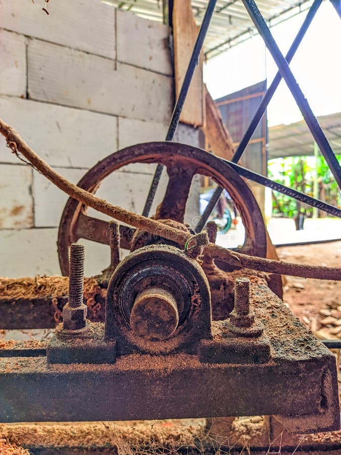 Close-up of rusty wheel against wall royalty free stock photography