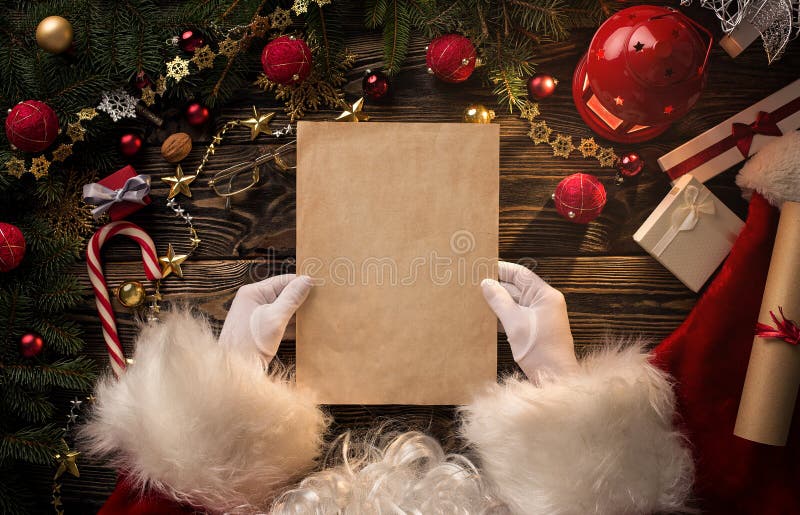 Santa Claus hands holding blank letter royalty free stock photos