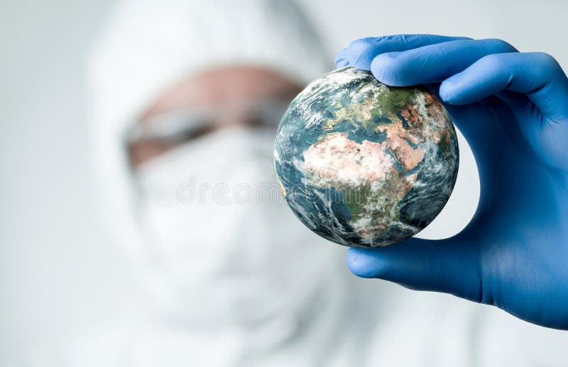 Close up of scientist holdnig and analyzing planet earth