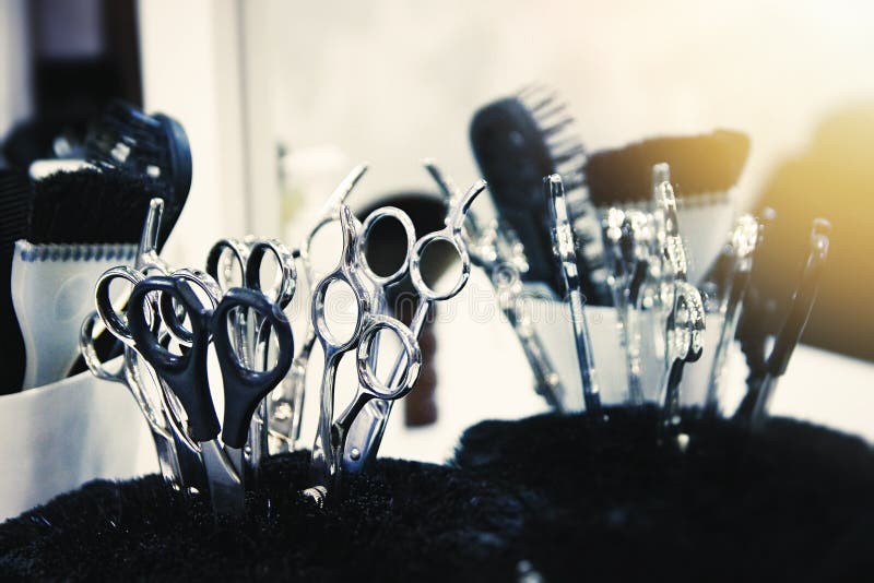 Closeup of Scissors and Brushes in a Stand. Beauty Salon Tools Stock
