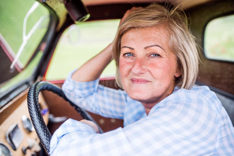 Close Up of Senior Woman Inside Vintage Pickup Truck Stock Image ...