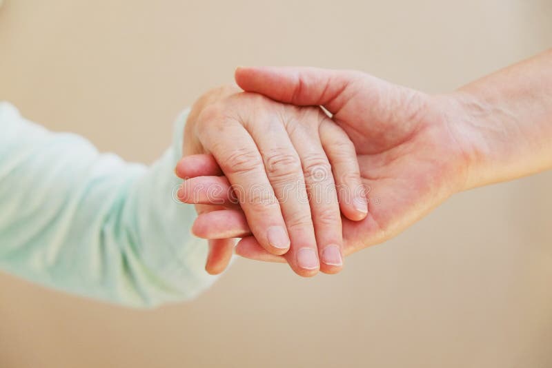 Close Up Of Senior Woman And Young Woman Holding Hands. Care And - 800x533 - jpeg Holding Hands Care
