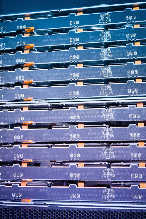 Close-up of a server with trays filled with hard disks inside internet cloud center