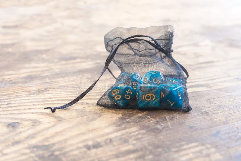 Close up set of blue color dice for many role playing games on wooden table royalty free stock image Close up set of blue color dice for many role playing games on wooden table royalty free stock image