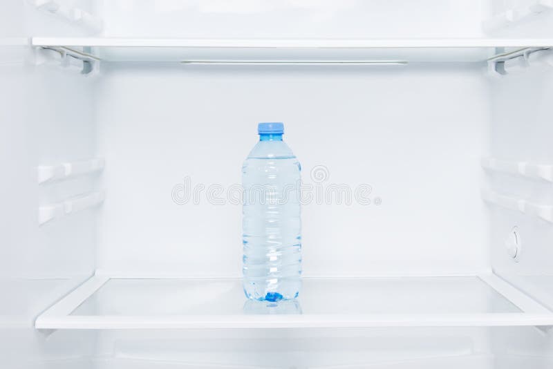 Premium Photo  Cold bottles of clean drinking water in a white refrigerator