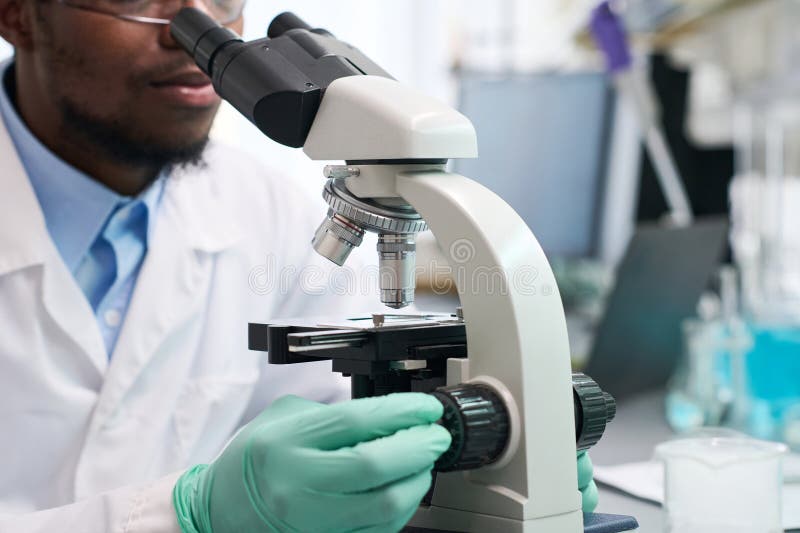 Laboratory Technician Using Microscope Stock Image Image of