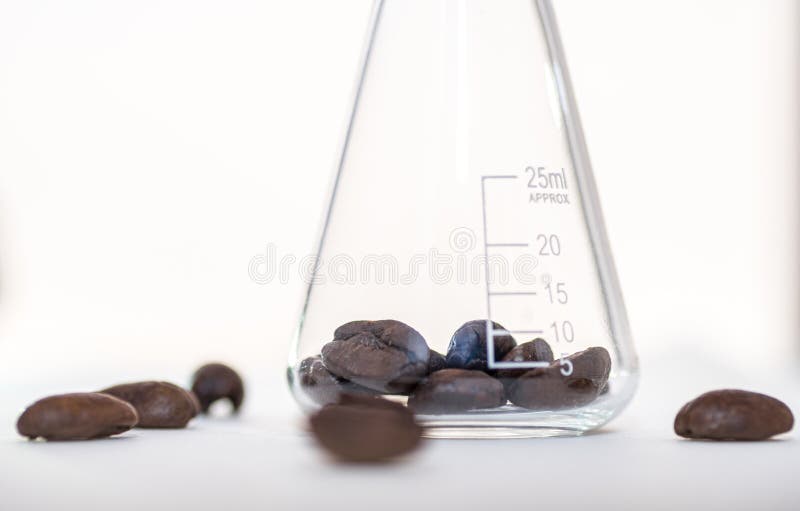 Close Up Shot of Coffee Beans in Laboratory Glassware Stock Photo