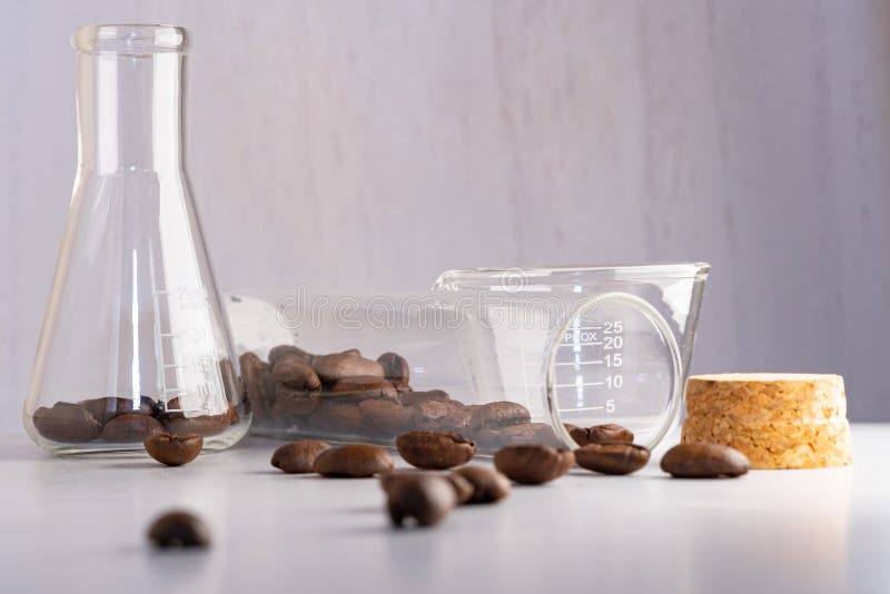 Close Up Shot of Coffee Beans in Laboratory Glassware Being Tested