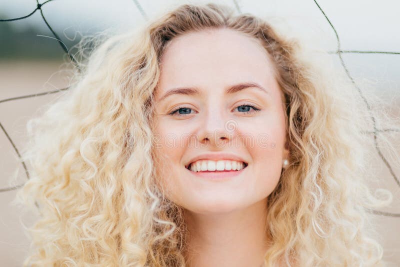 Close Up Portrait of Happy Young Cute Female with Curly Hair, Looks ...