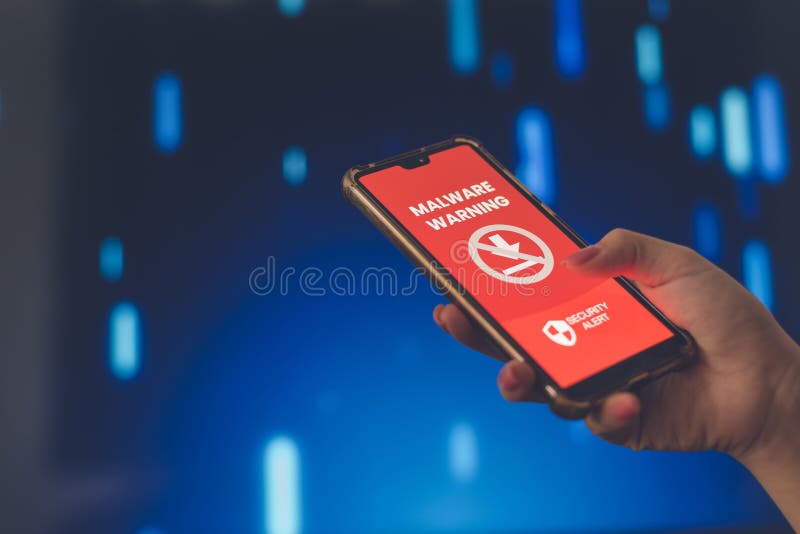 Hand holding smartphone with malware warning on screen, data security risk concept. stock photos