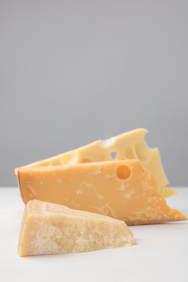 Close up shot of different types of cheese on gray royalty free stock images Close up shot of different types of cheese on gray royalty free stock images