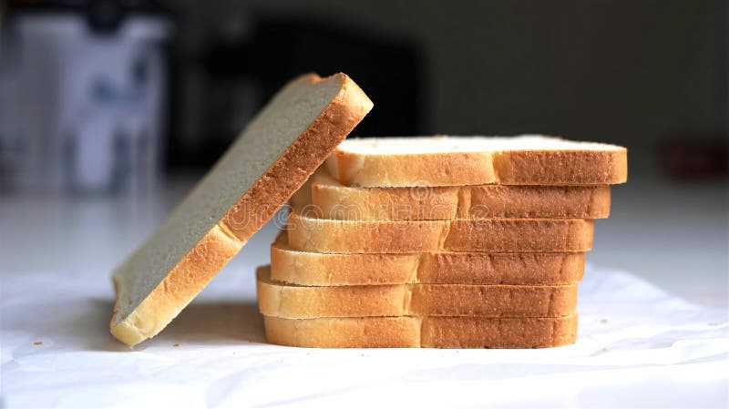 Stack of Freshly Sliced White Bread on a White Surface royalty free illustration