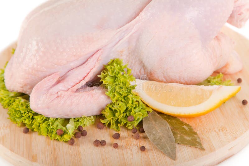 Close-up shot of fresh raw chicken with condiments