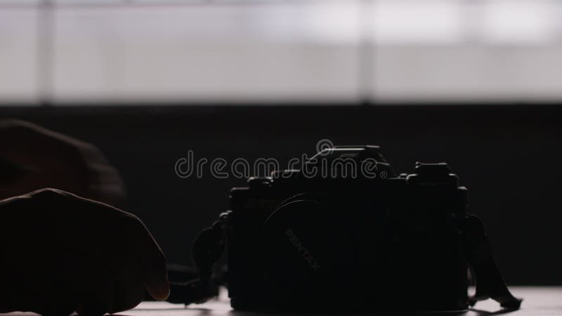 Close-up shot of the hands holding the camera gently and the background blurred stock footage