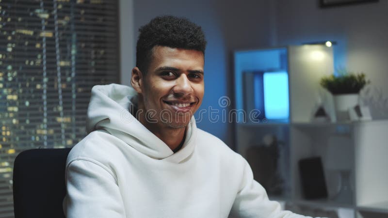 Handsome Black Man Smiling To the Camera while Working Home Stock Image - Image of background, lifestyle: 181867685 Handsome Black Man Smiling To the Camera while Working Home Stock Image - Image of background, lifestyle: 181867685