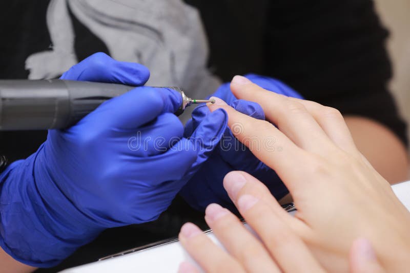 Close Up Shot of Hardware Manicure in a Beauty Salon. Manicurist in ...