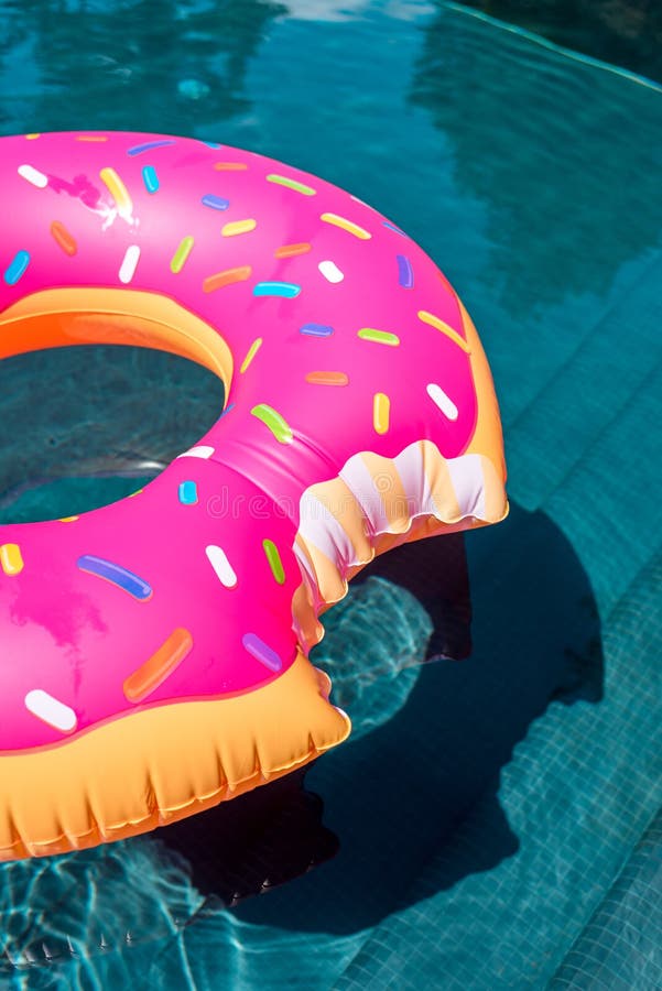 Close-up Shot of Inflatable Ring in Shape of Bitten Donut Floating ...