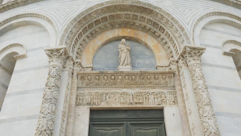 Close up shot of the intricate architectural detail on the baptistry, Pisa