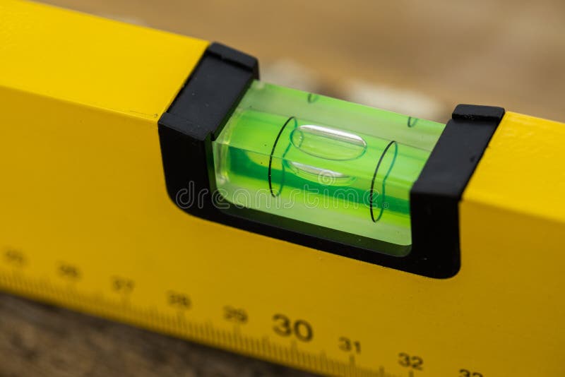 Shot of a level tool , yellow block level with bubble clipping path included. royalty free stock image