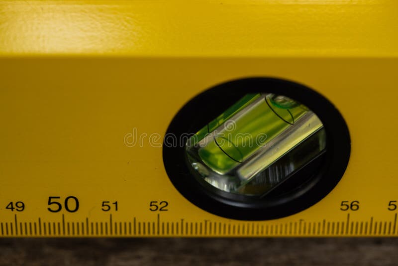 A close-up shot of a level tool , yellow block level with bubble clipping path included.