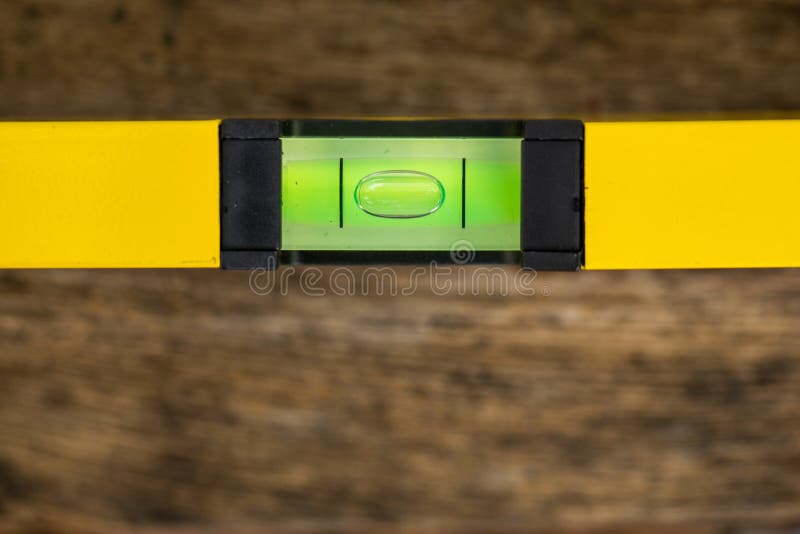 Shot of a level tool , yellow block level with bubble clipping path included. stock photo