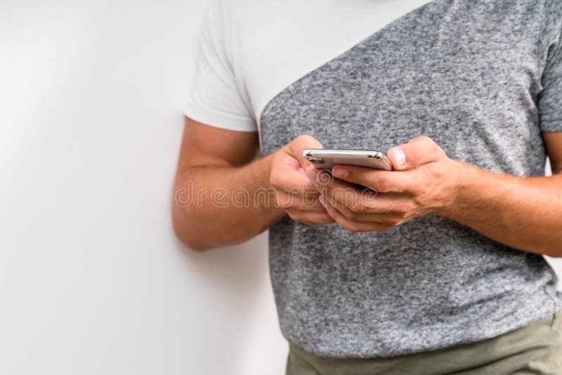 Close up shot of man`s hands holding smart cell phone with blank stock photos Close up shot of man`s hands holding smart cell phone with blank stock photos