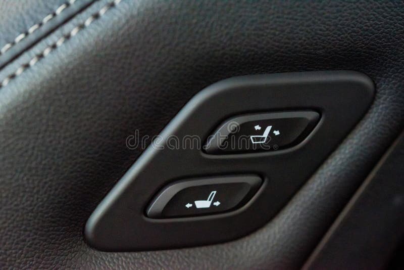 Close Up Shot of Modern Car Central Console with Seat Controls Stock