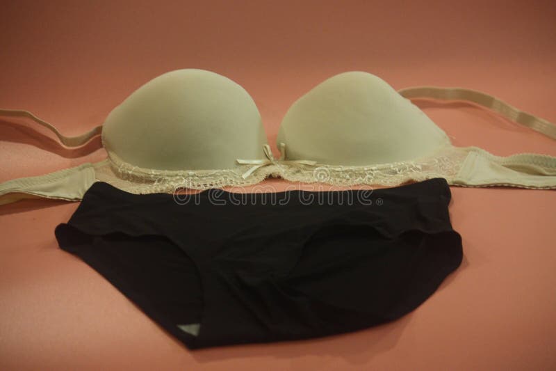 Close-up Shot of Multi Colored Seamless Smooth Push Up Bra and Black  Seamless Hipster Panty on the Pink Background. Stock Image - Image of shot,  smooth: 232320161