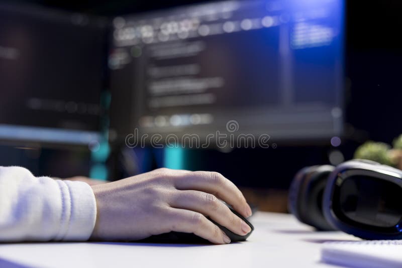 Close up shot of programmer installing fortified code on PC, using mouse royalty free stock photos