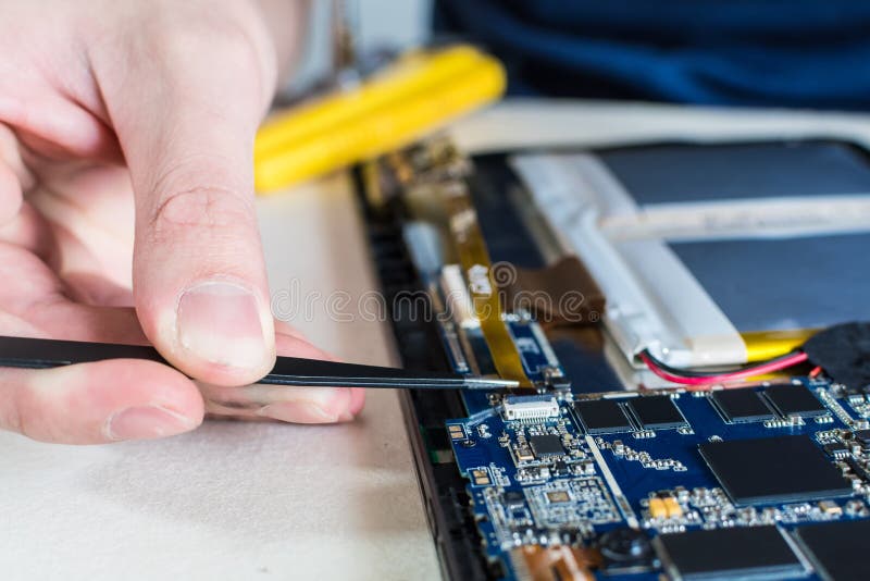 Close Up Shot of Smart Phone and Tablet Repair in a Technology Lab
