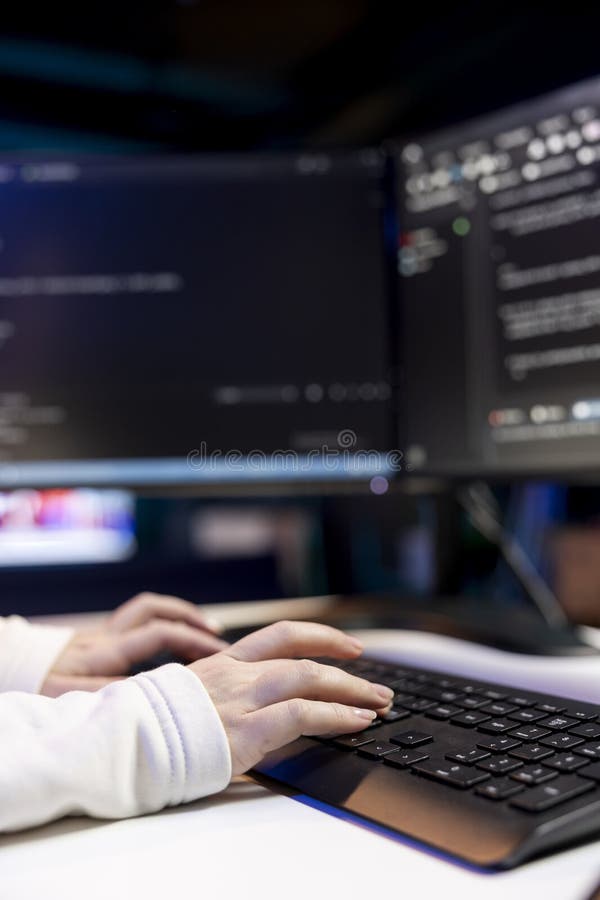Close up shot of IT specialist writing, testing and debugging code royalty free stock image