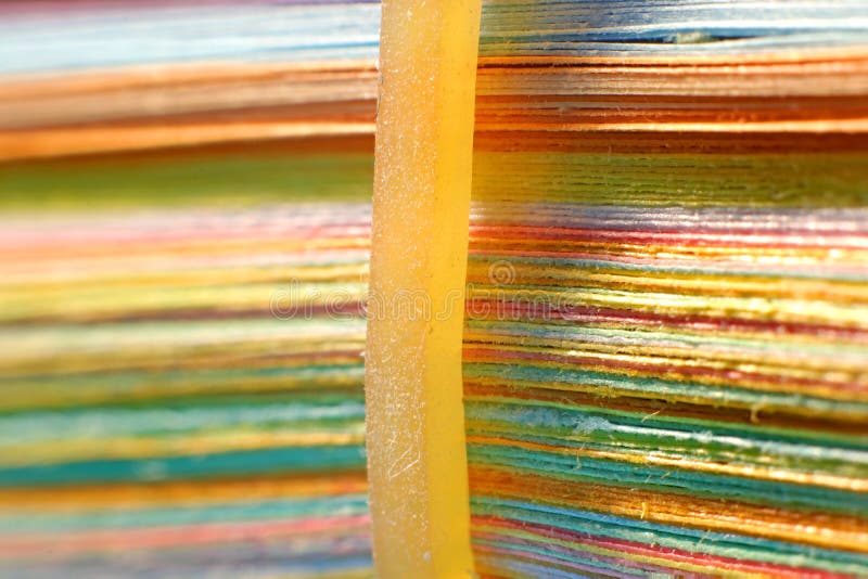 Close up shot of stack of color papers stock photo