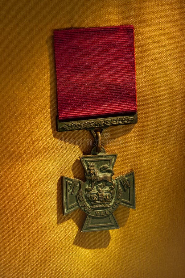 Close up shot of Victoria Cross medal on golden background
